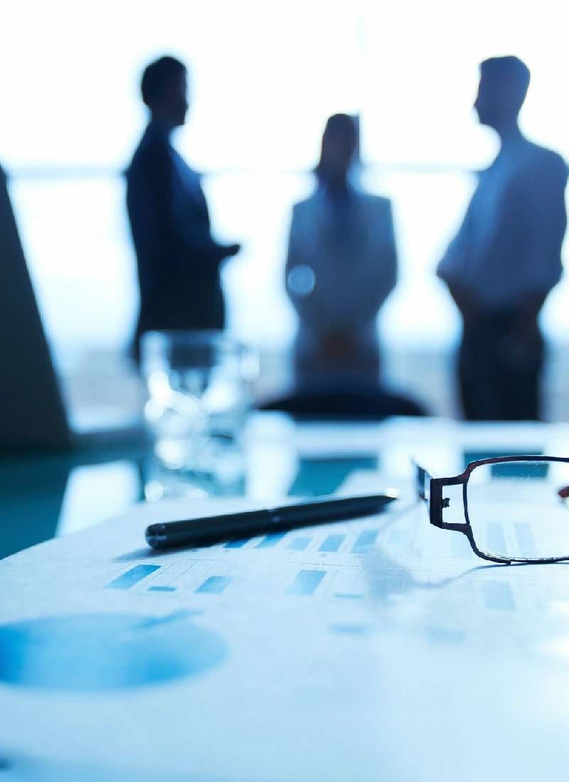 A table with glasses and pen on it